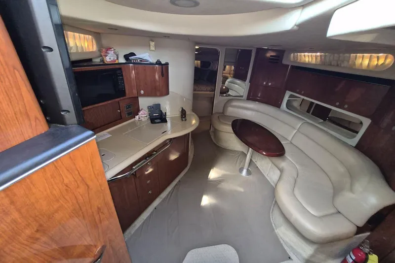 Slide: The Image of Luxurious interior of 2004 Sea Ray 380 Sundancer yacht with leather seating and kitchenette. - 21