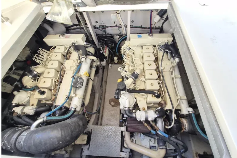 Slide: The Image of Engine room of 2004 Sea Ray 380 Sundancer with dual engines and complex wiring. - 3