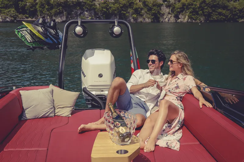 Slide: The Image of Couple enjoying a luxurious day on a 2026 Cranchi E26 Rider boat. - 10