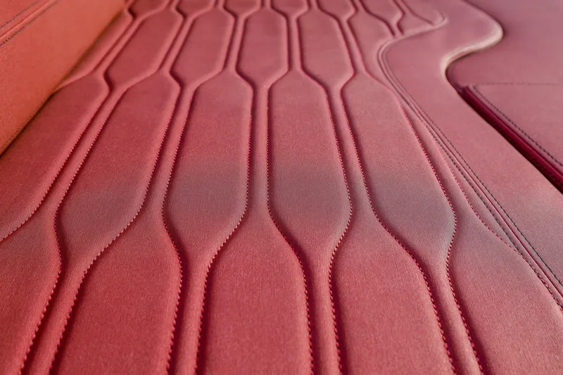 Slide: The Image of Red leather upholstery detail in 2026 Cranchi E26 Rider boat interior. - 43