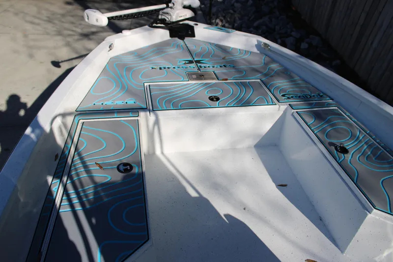 Slide: The Image of 2026 Xpress H22B Bay boat deck with custom SeaDek flooring design. - 16