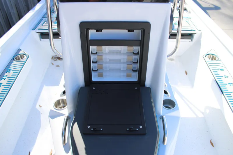 Slide: The Image of 2026 Xpress H22B Bay boat interior with storage compartments and cup holders. - 20
