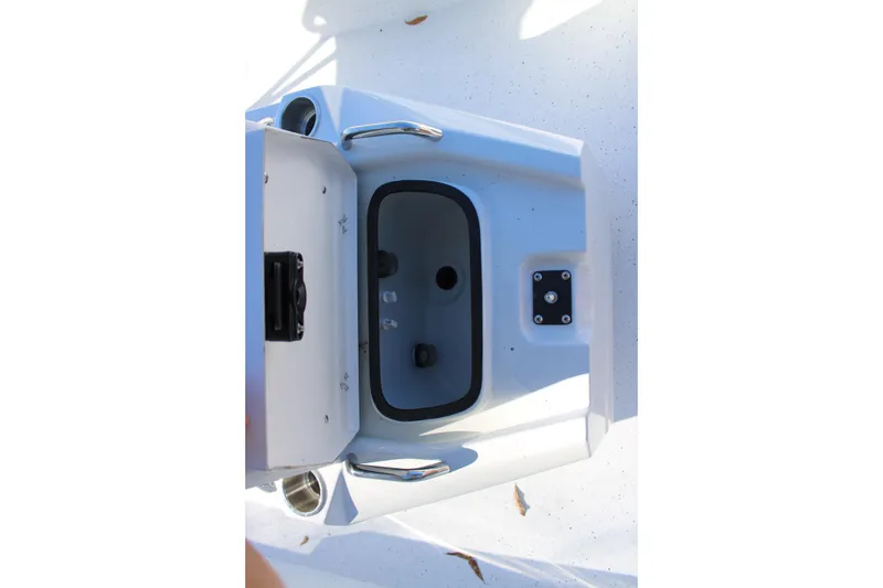Slide: The Image of Open storage compartment on 2026 Xpress H22B Bay boat, featuring sleek design and functionality. - 21