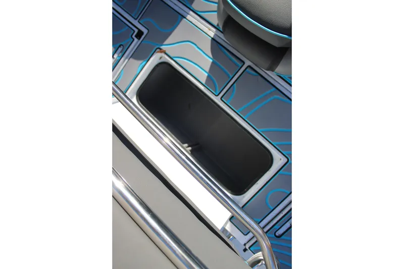 Slide: The Image of 2026 Xpress H22B Bay boat interior with storage compartment and stylish blue accents. - 25
