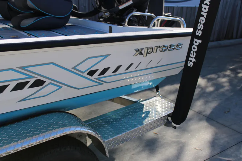 Slide: The Image of 2026 Xpress H22B Bay boat with sleek design and custom graphics. - 26