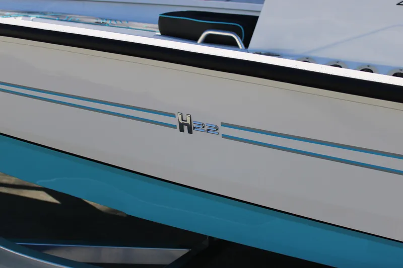 Slide: The Image of 2026 Xpress H22B Bay boat with sleek blue and white design. - 27