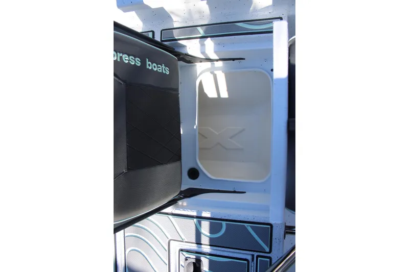 Slide: The Image of 2026 Xpress H20B Bay boat interior with storage compartment and seating. - 10