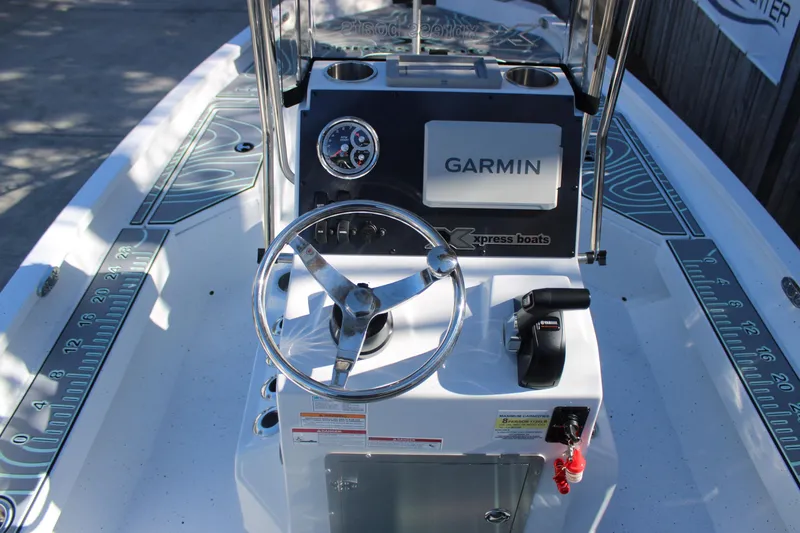 Slide: The Image of 2026 Xpress H20B Bay boat console with Garmin navigation and Yamaha controls. - 12