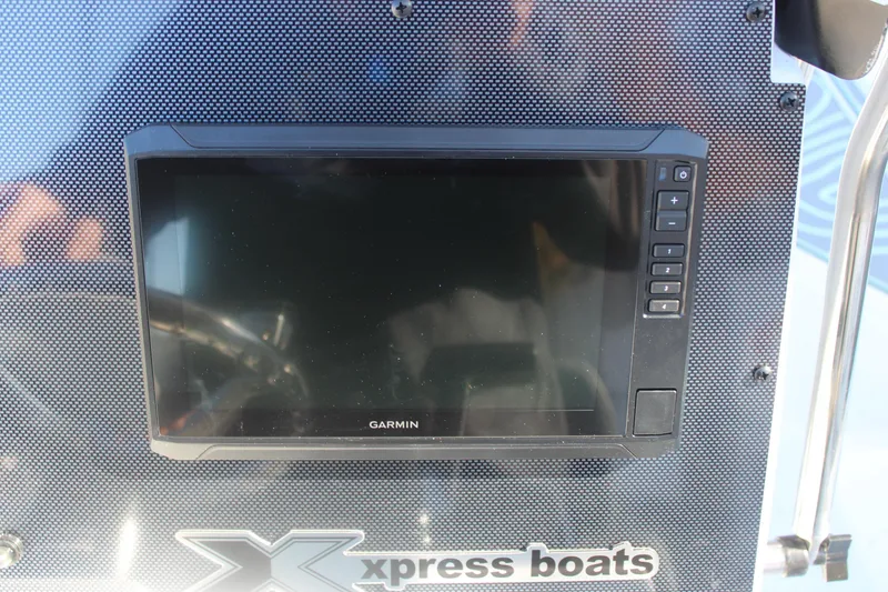 Slide: The Image of Garmin display on 2026 Xpress H20B Bay boat dashboard. - 14
