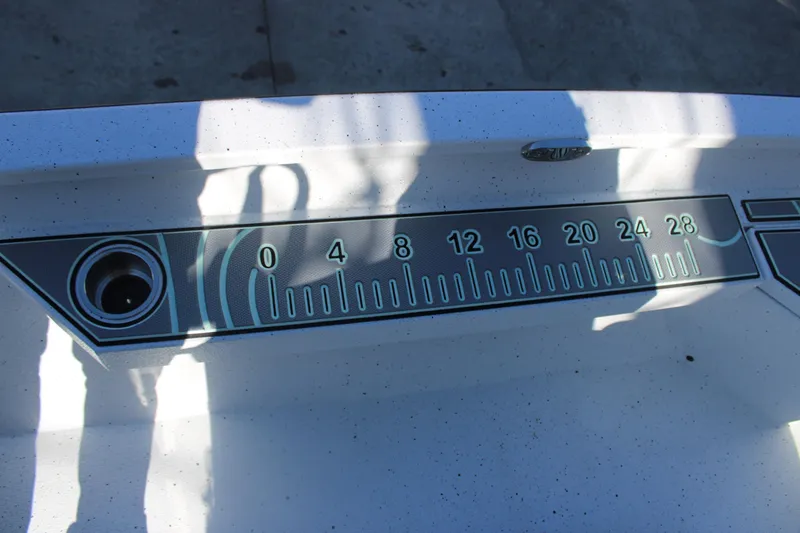 Slide: The Image of 2026 Xpress H20B Bay boat ruler detail with shadow reflections. - 16