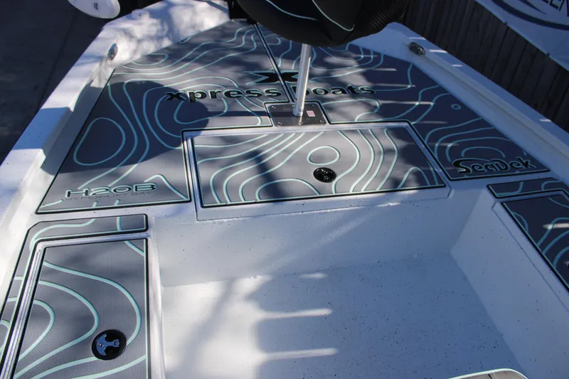 Slide: The Image of 2026 Xpress H20B Bay boat deck with custom SeaDek design. - 17