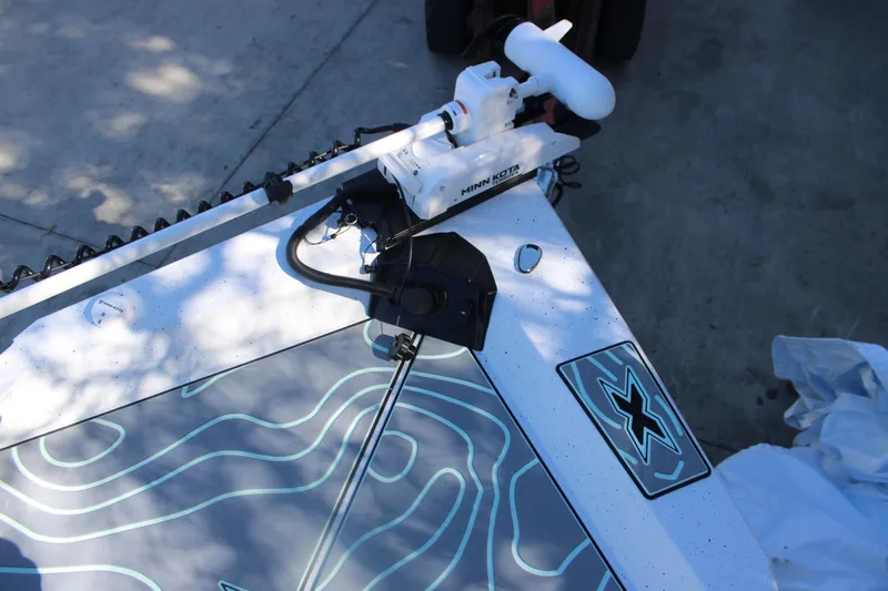 Slide: The Image of 2026 Xpress H20B Bay boat with Minn Kota trolling motor on deck. - 19