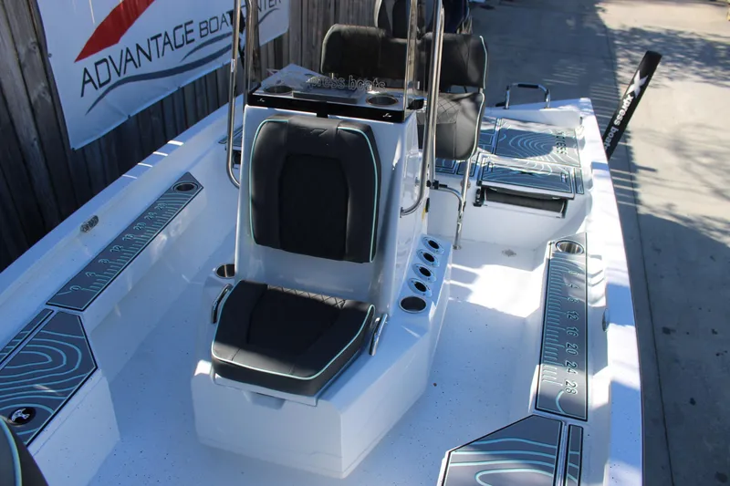 Slide: The Image of 2026 Xpress H20B Bay boat interior with seating and measurement details. - 21
