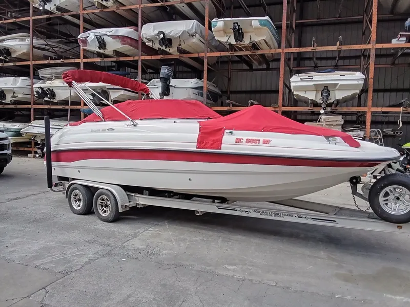 Slide: The Image of Rear view of a 1999 Chaparral 232 Sunesta boat on grass. - 5