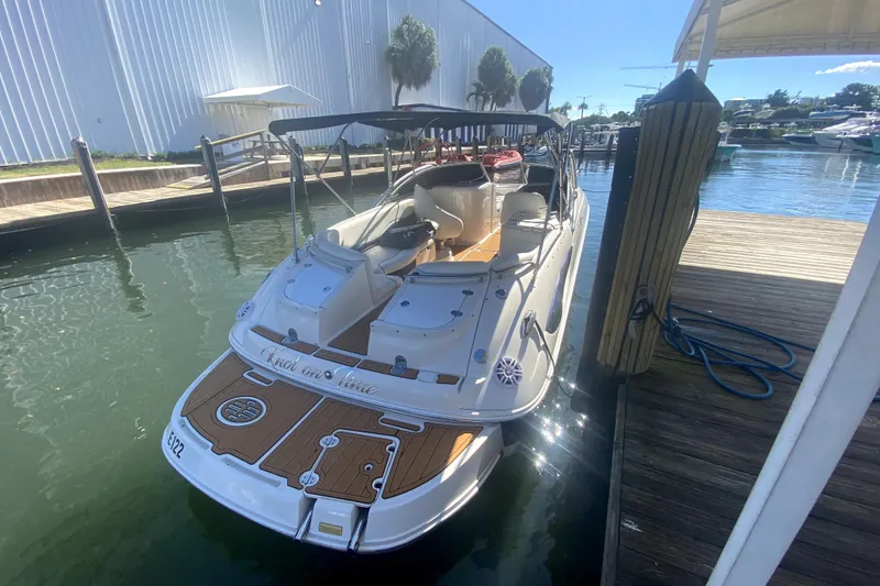 Slide: The Image of 2006 Monterey 263 Explorer Sport boat docked at marina, sunny day. - 11