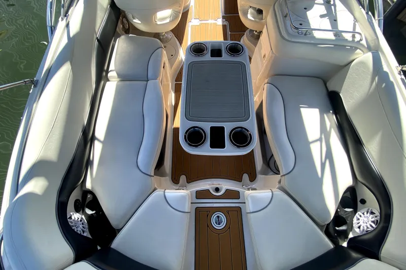 Slide: The Image of Interior of 2006 Monterey 263 Explorer Sport boat with seating and table. - 15