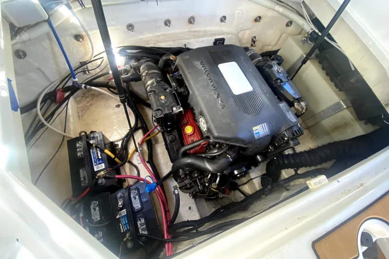 Slide: The Image of Engine compartment of 2006 Monterey 263 Explorer Sport boat with visible batteries and wiring. - 40