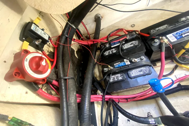 Slide: The Image of Battery compartment of a 2006 Monterey 263 Explorer Sport with wiring and switch. - 42