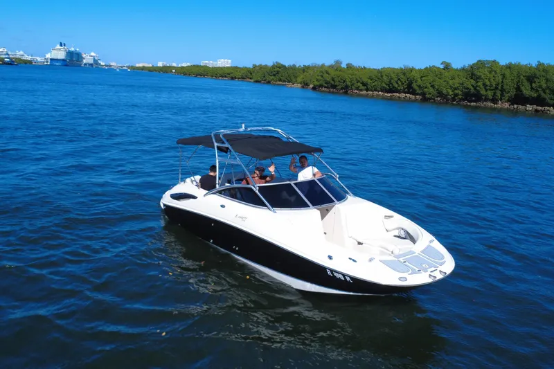 Slide: The Image of 2006 Monterey 263 Explorer Sport boat cruising on a sunny day in blue waters. - 9