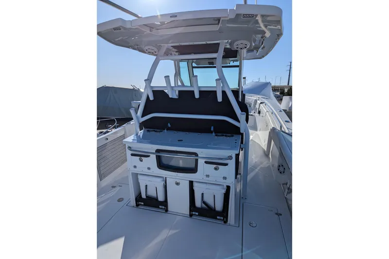 Slide: The Image of 2024 Blackfin 332 CC boat interior with modern helm and seating area. - 12