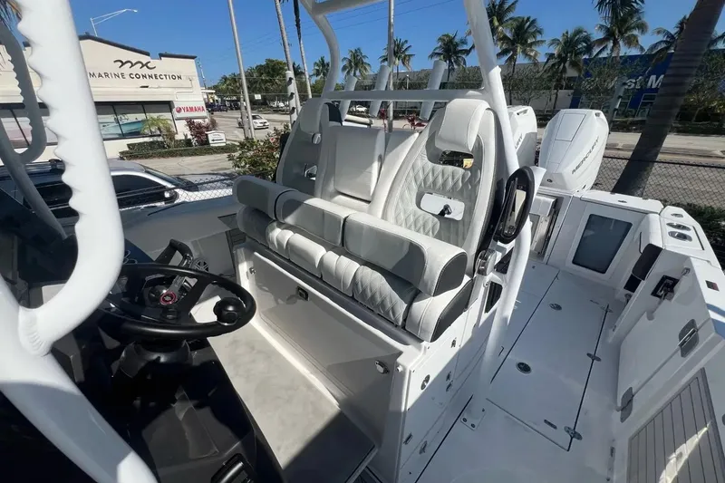 Slide: The Image of 2024 Blackfin 332 CC boat interior with luxurious seating and modern controls. - 31