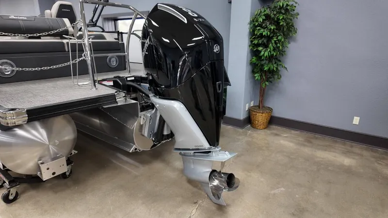 Slide: The Image of 2026 Barletta Corsa 23UC with outboard motor in showroom. - 11