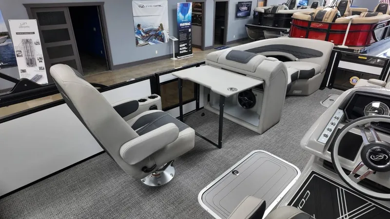Slide: The Image of Interior of 2026 Barletta Corsa 23UC with luxurious seating and table. - 31