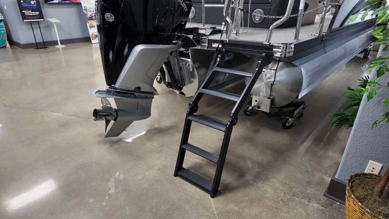 Slide: The Image of Barletta Corsa 23UC 2026 with outboard motor and ladder. - 5