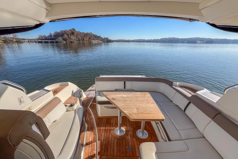 Slide: The Image of 2018 Sea Ray Sundancer 350 Coupe interior with scenic lake view. - 18