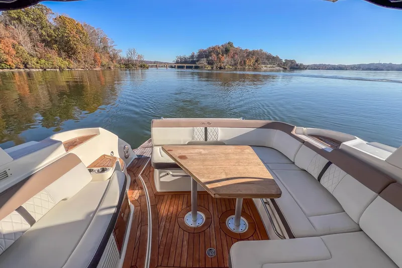 Slide: The Image of 2018 Sea Ray Sundancer 350 Coupe, elegant seating area with scenic lake view. - 19