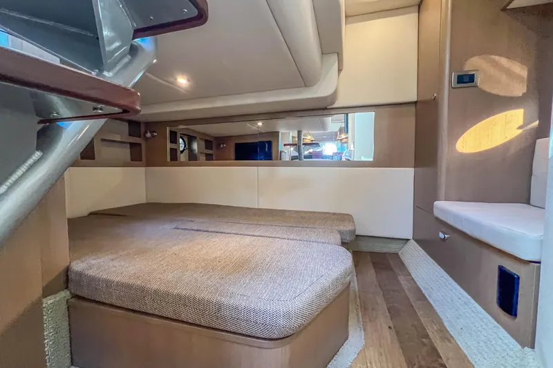 Slide: The Image of Interior cabin of 2018 Sea Ray Sundancer 350 Coupe, featuring cozy seating and modern design. - 32