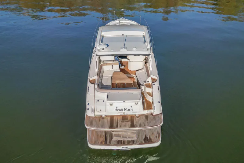 Slide: The Image of 2018 Sea Ray Sundancer 350 Coupe yacht on calm water, aerial view. - 7