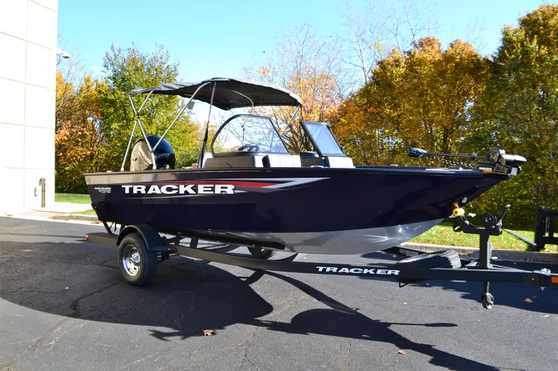 The Image of 2026 Tracker Pro Guide V-175 Combo boat on trailer, parked outdoors. - 0