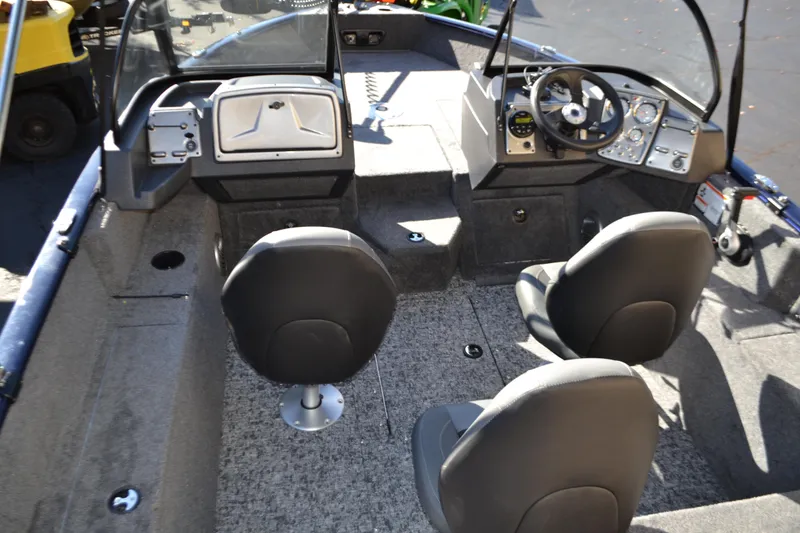 Slide: The Image of 2026 Tracker Pro Guide V-175 Combo boat interior with dual seats and control panel. - 3