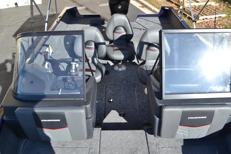 Slide: The Image of 2026 Tracker Pro Guide V-175 Combo boat interior with seating and dual consoles. - 4