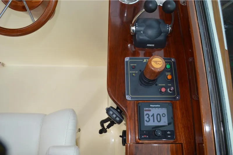 Slide: The Image of Control panel of a 2009 Hinckley 37 boat with navigation instruments. - 20