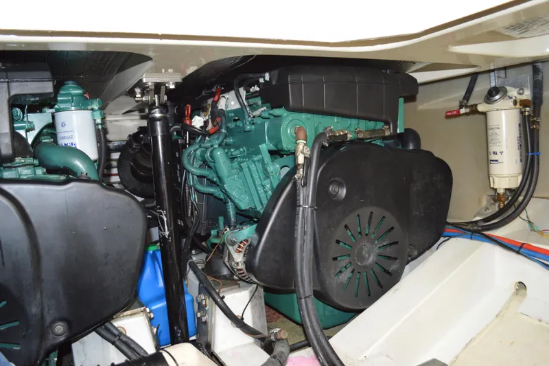 Slide: The Image of Engine compartment of a 2009 Hinckley 37 boat, showcasing mechanical components. - 36