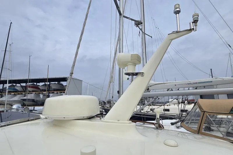 Slide: The Image of 2009 Hinckley 37 yacht radar and navigation equipment on deck, docked at marina. - 12