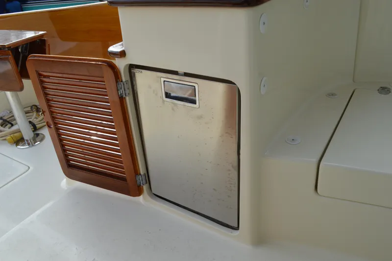 Slide: The Image of Hinckley 37 yacht interior, featuring wooden and stainless steel cabinetry, 2009 model. - 18