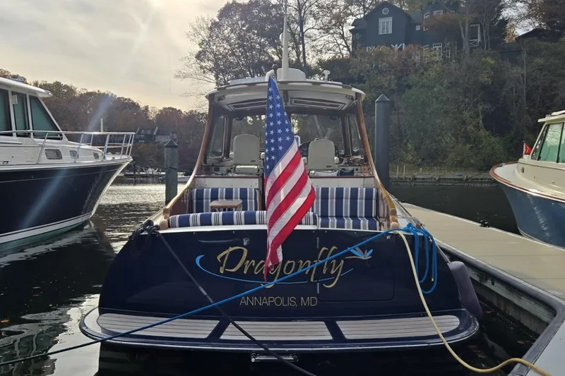 Slide: The Image of Hinckley 37 boat, 2009 model, docked in Annapolis, MD with American flag. - 9