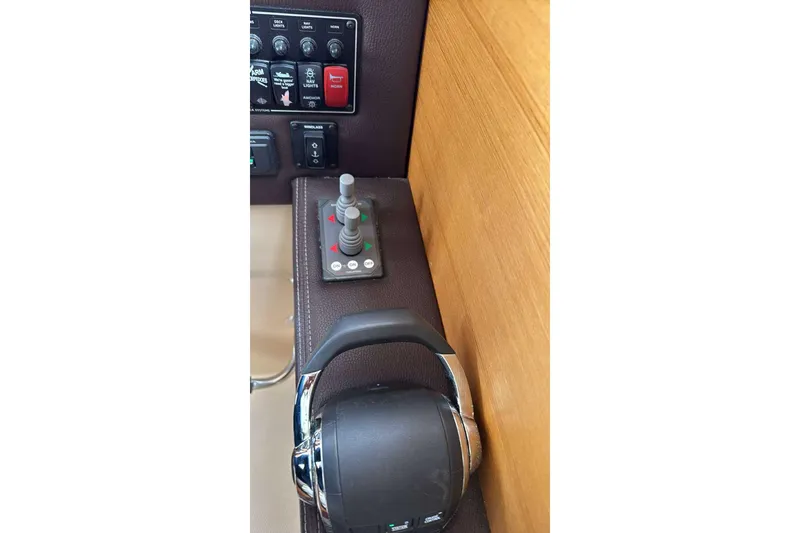 Slide: The Image of Control panel of 2014 Ranger Tugs R-27 boat with joystick and switches. - 6