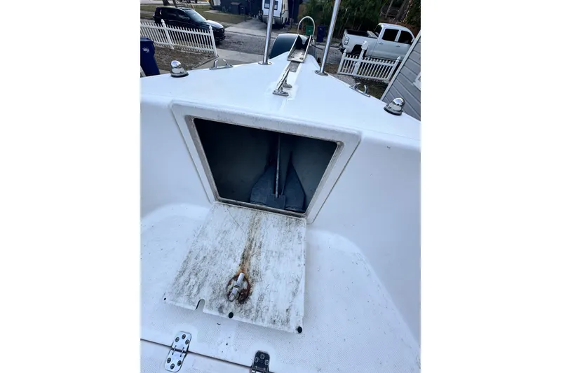 Slide: The Image of 2006 Century 2001 Center Console boat with open storage compartment on deck. - 10