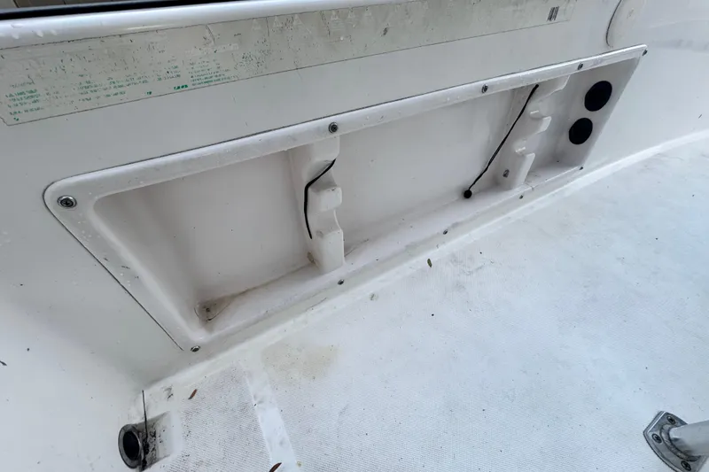 Slide: The Image of 2006 Century 2001 Center Console boat interior detail, showing storage compartment and wiring. - 13
