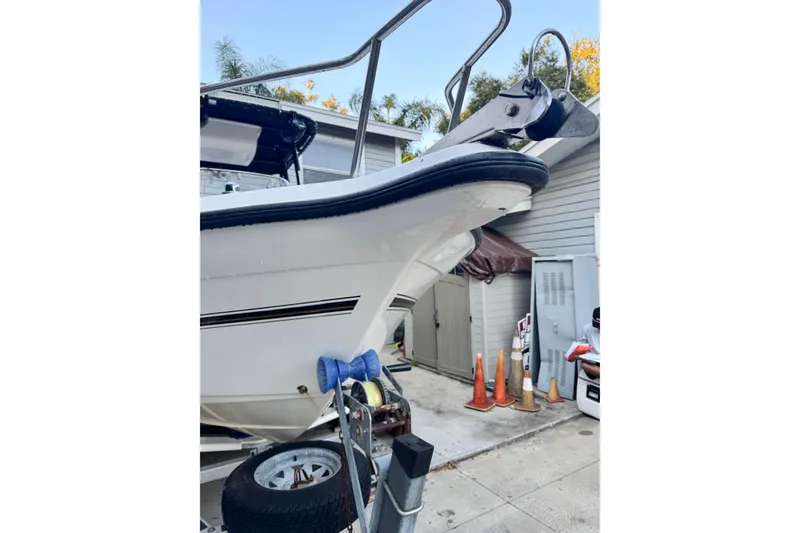 Slide: The Image of Century 2001 Center Console boat, 2006 model, on trailer in driveway. - 21