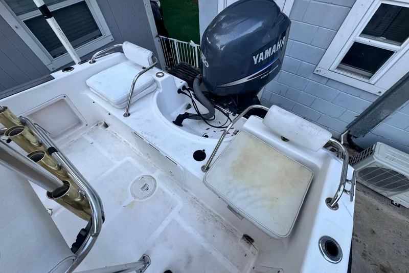 Slide: The Image of 2006 Century 2001 Center Console boat with Yamaha outboard motor, featuring seating and rod holders. - 7