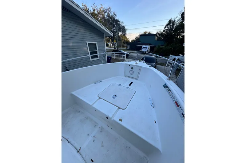 Slide: The Image of 2006 Century 2001 Center Console boat parked in a residential driveway. - 8