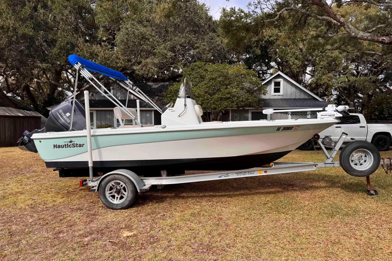 The Image of 2017 NauticStar 1810 NauticBay boat on trailer, parked in a yard. - 0