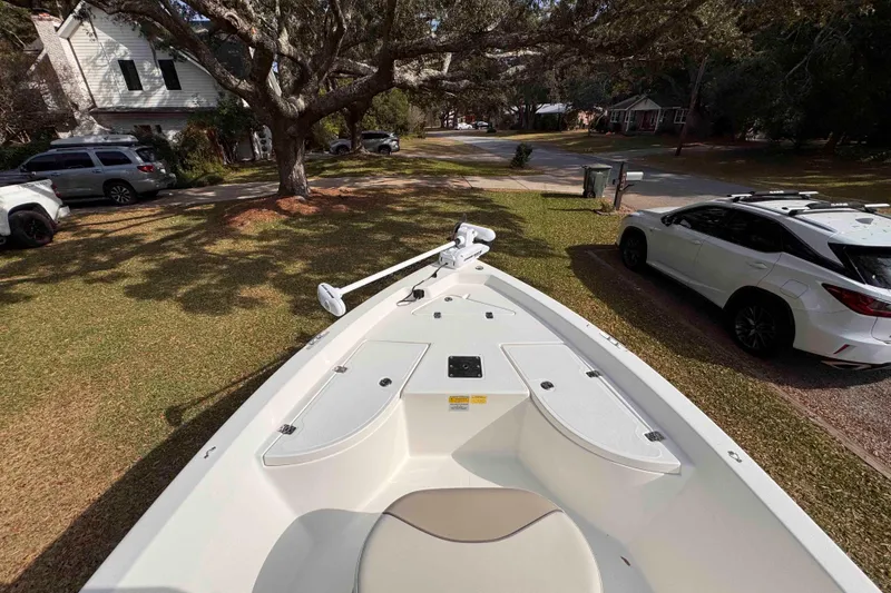Slide: The Image of 2017 NauticStar 1810 NauticBay boat parked on a grassy residential area. - 14
