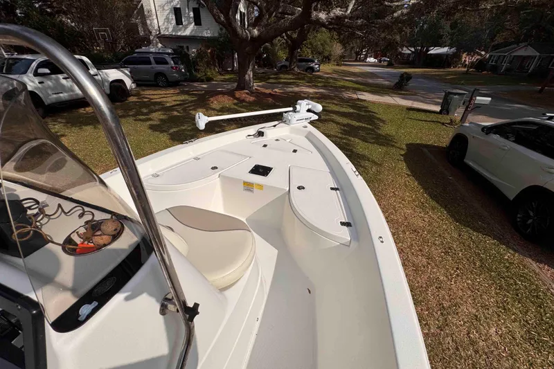 Slide: The Image of 2017 NauticStar 1810 NauticBay boat parked in a residential driveway. - 19