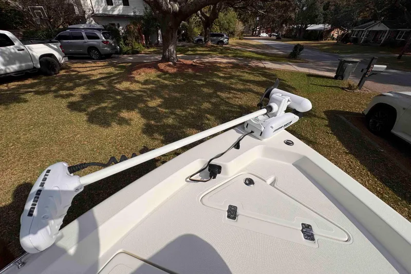 Slide: The Image of 2017 NauticStar 1810 NauticBay boat with trolling motor on grassy lawn. - 20